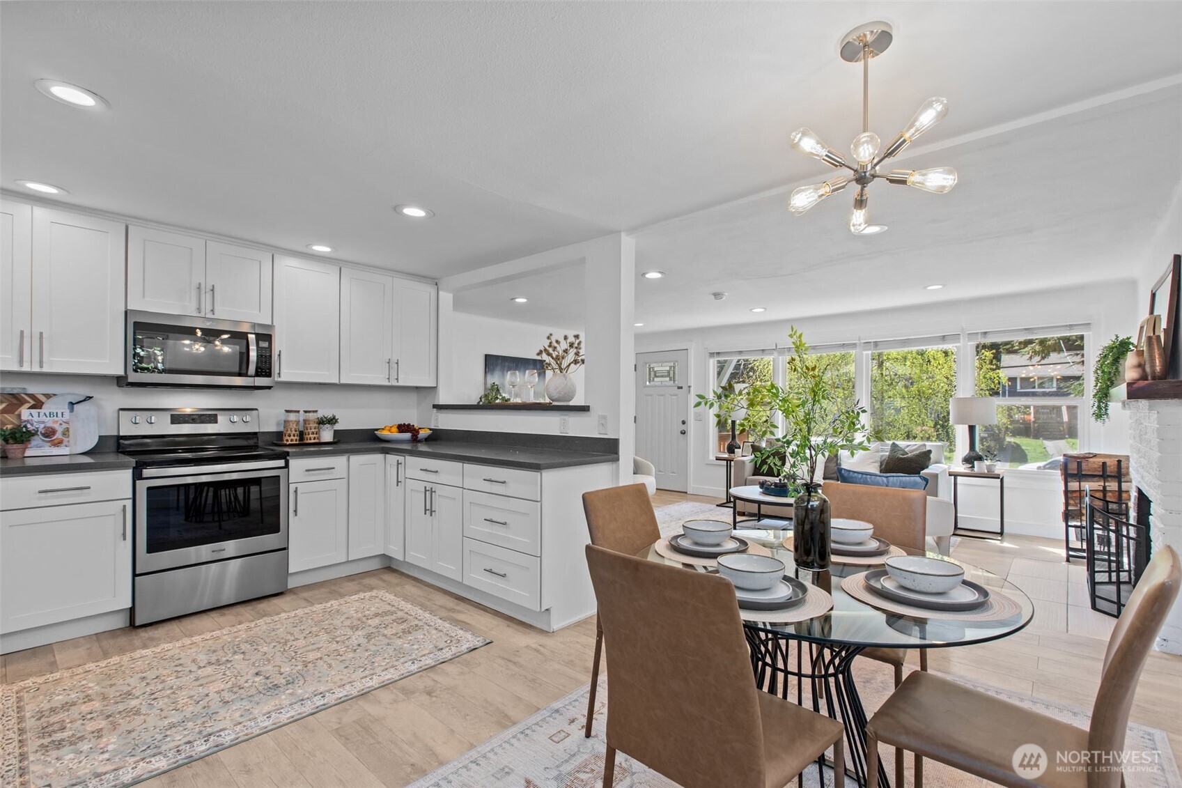 2018 Northeast 97th Street Seattle, WA 98115 - Photo 13 of 39 a kitchen with a dining table chairs and refrigerator