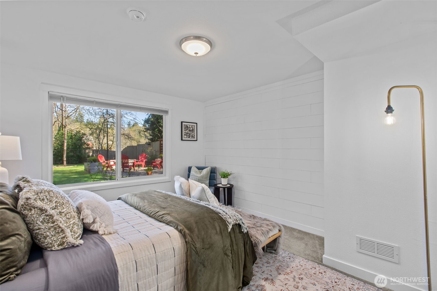 2018 Northeast 97th Street Seattle, WA 98115 - Photo 18 of 39 a bedroom with a bed and a large window