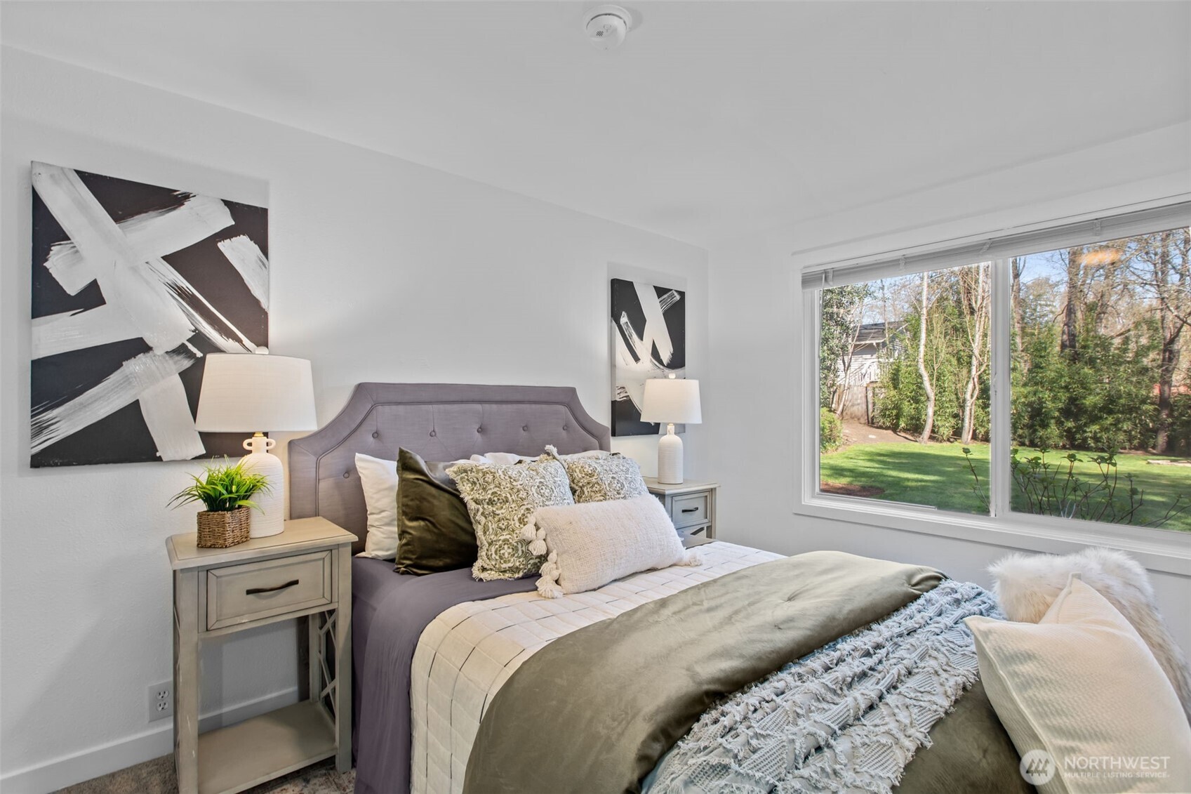 2018 Northeast 97th Street Seattle, WA 98115 - Photo 19 of 39 a bed sitting in a bedroom next to a window