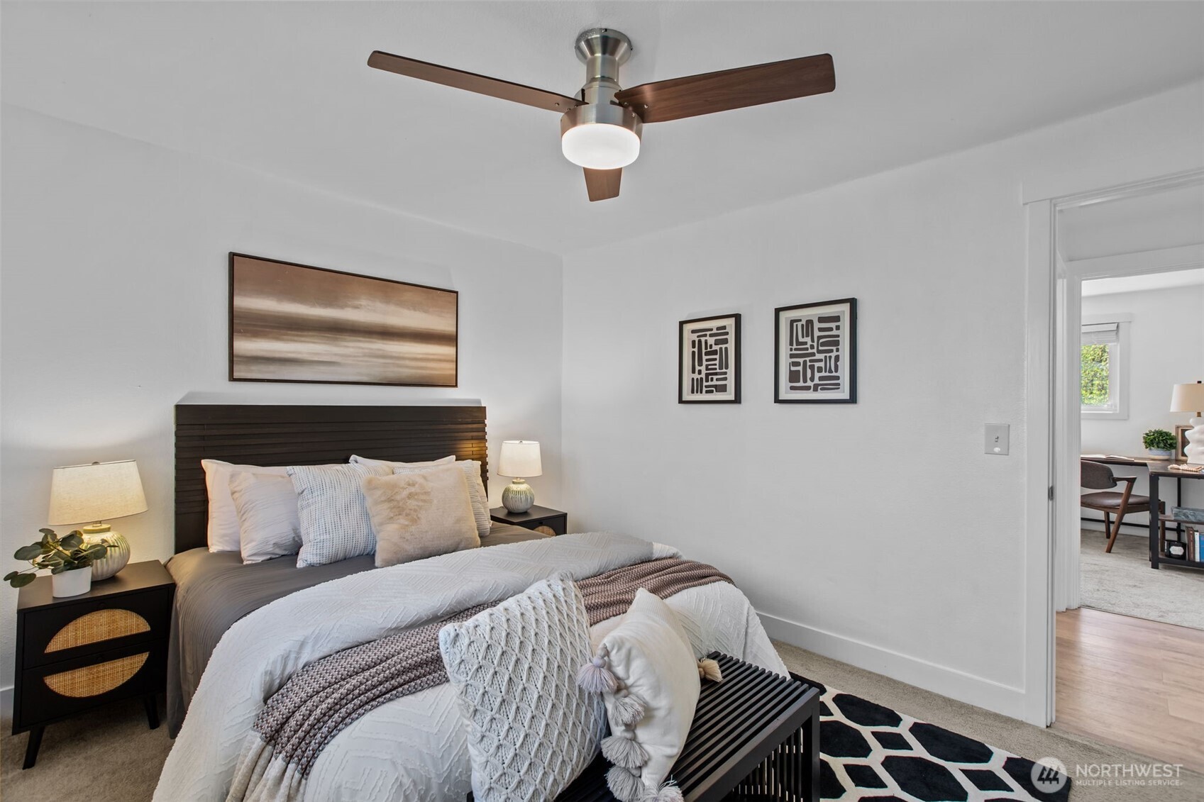 2018 Northeast 97th Street Seattle, WA 98115 - Photo 27 of 39 a bedroom with a bed and a chandelier