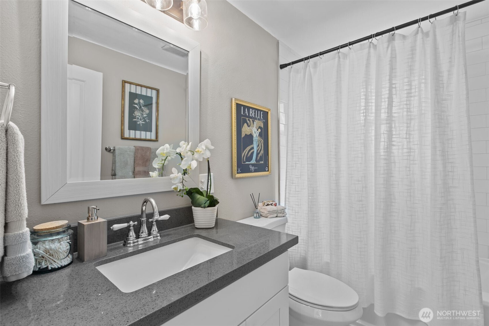 2018 Northeast 97th Street Seattle, WA 98115 - Photo 29 of 39 a bathroom with a toilet a sink and mirror