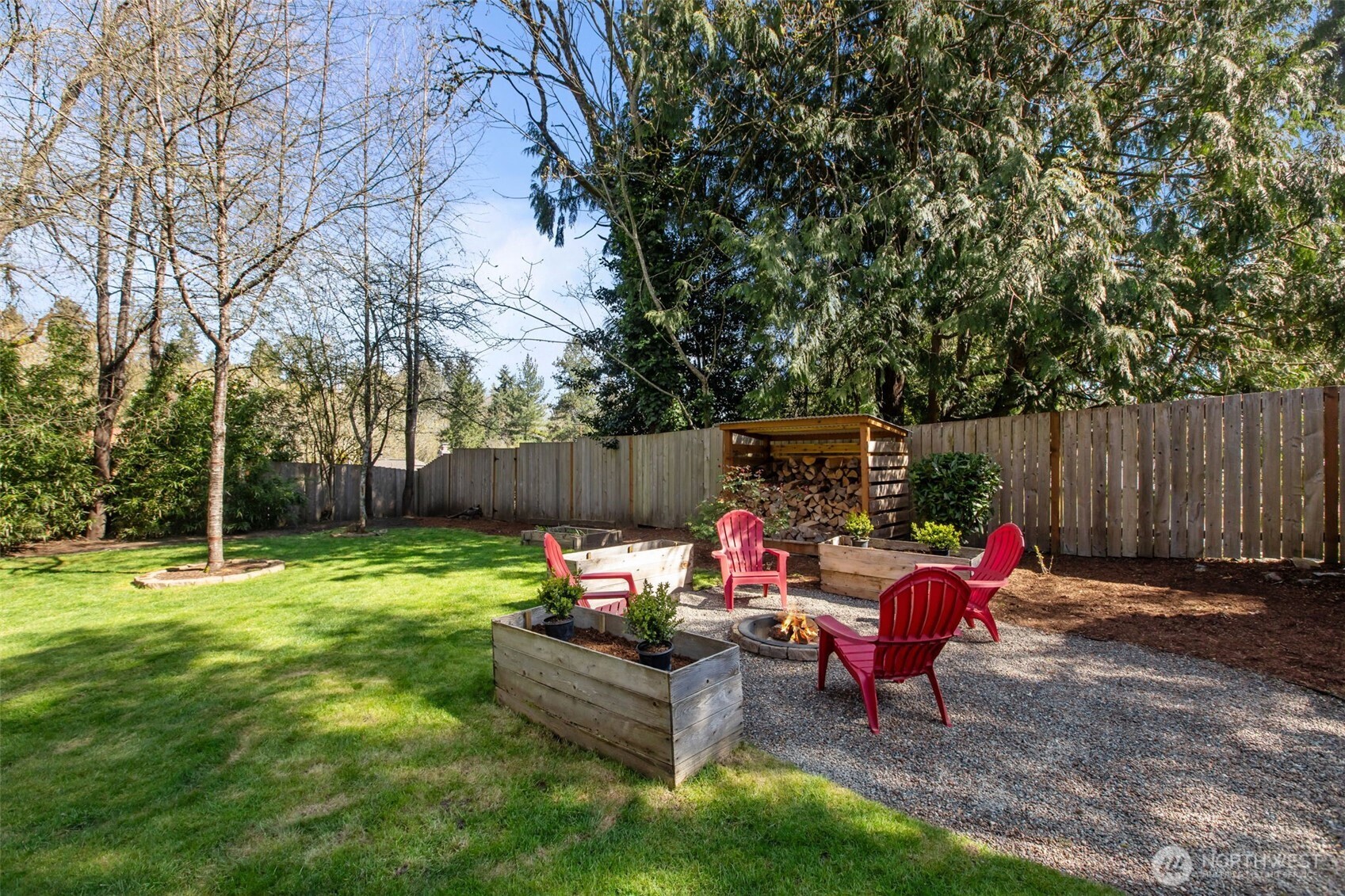 2018 Northeast 97th Street Seattle, WA 98115 - Photo 37 of 39 a backyard of a house with table and chairs