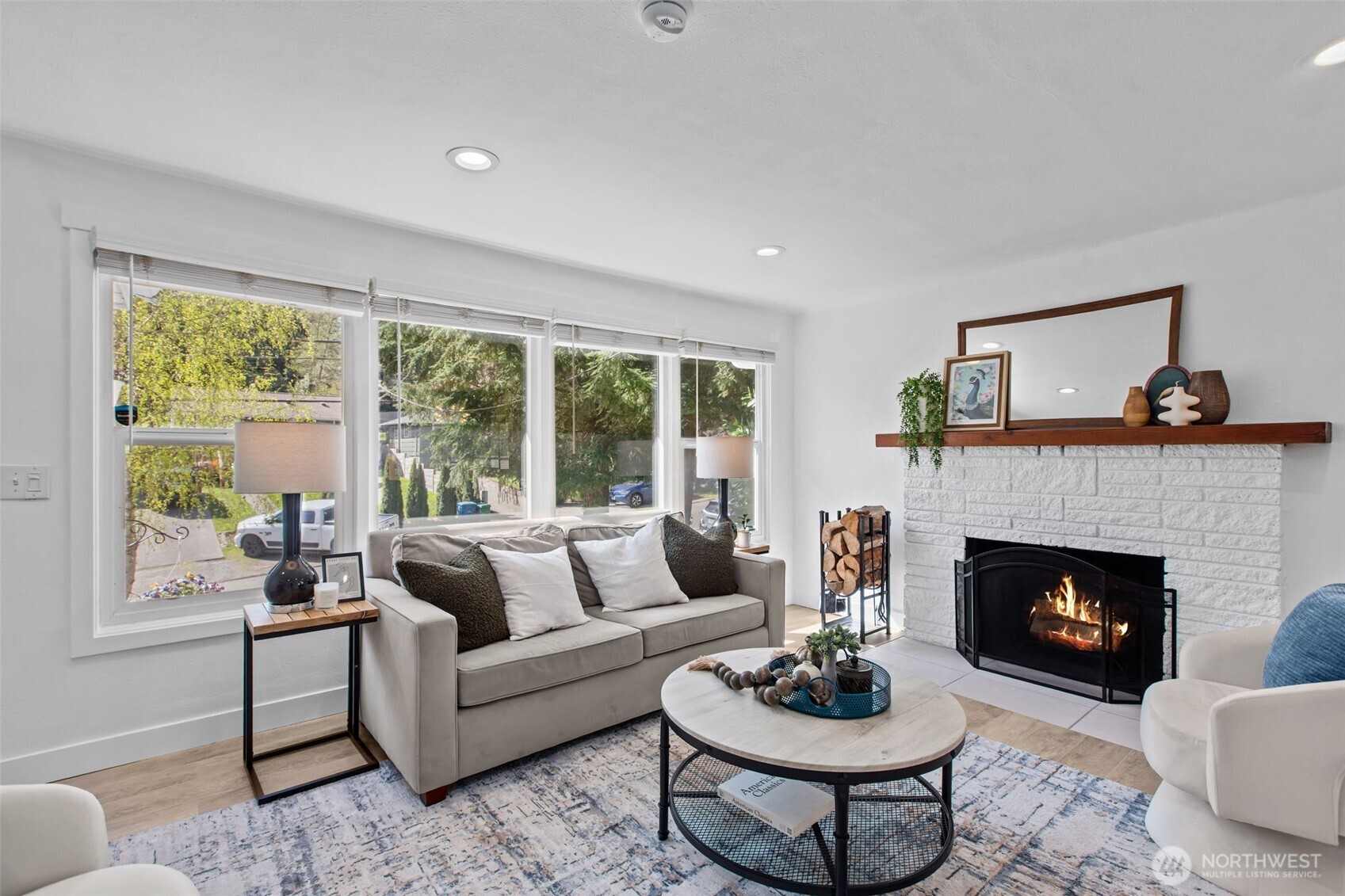 2018 Northeast 97th Street Seattle, WA 98115 - Photo 7 of 39 a living room with furniture a window and a fireplace