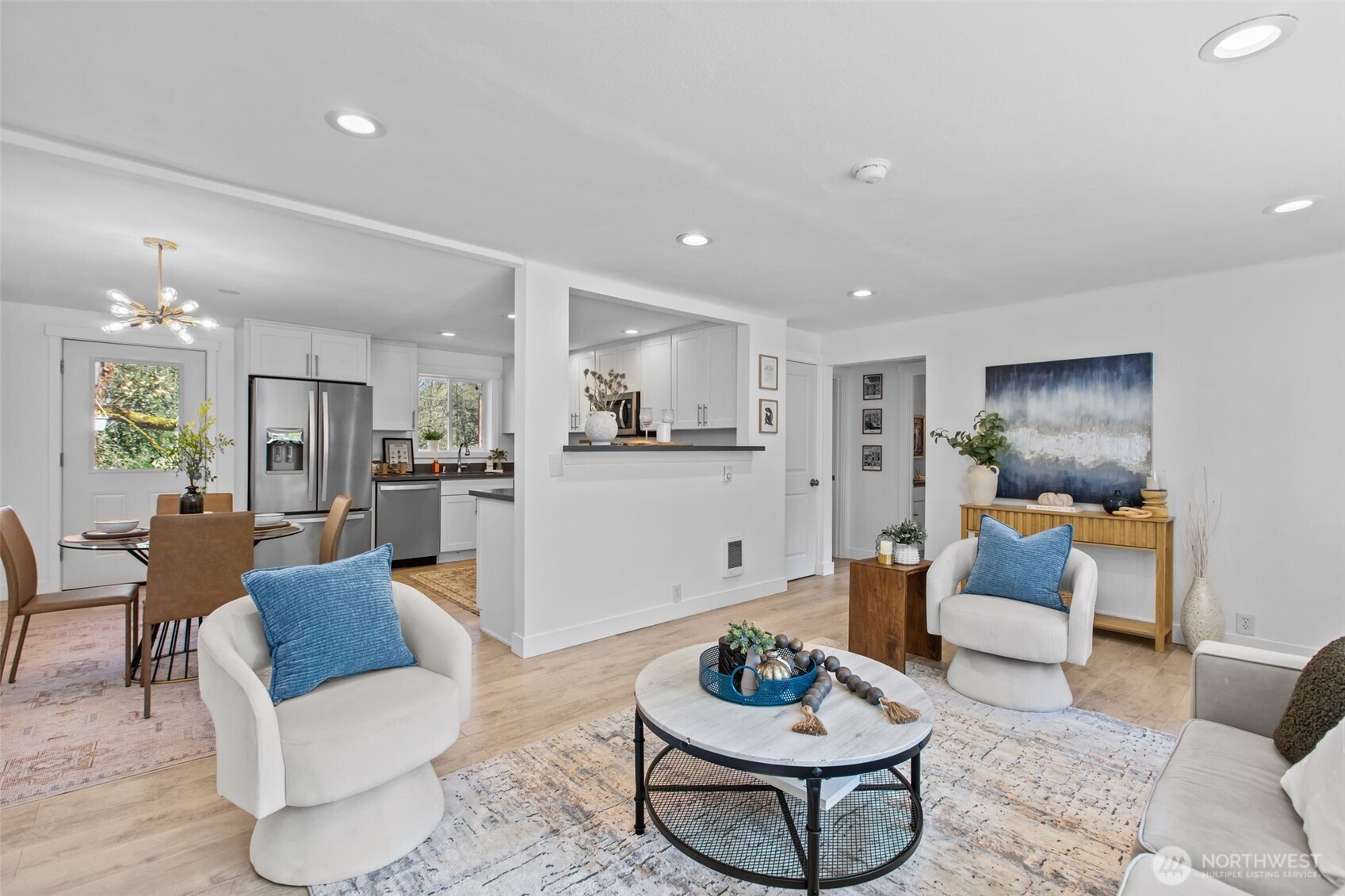2018 Northeast 97th Street Seattle, WA 98115 - Photo 9 of 39 a living room with furniture and a dining table with kitchen view