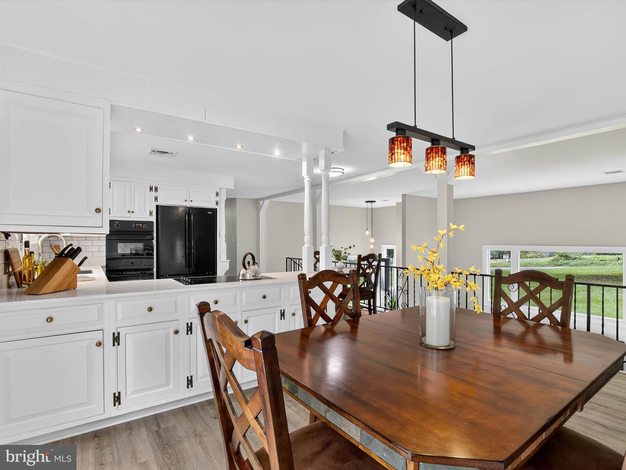 2010 Landis Valley Road Lancaster, PA 17601 - Photo 22 of 76 a view of a dining room and livingroom with furniture wooden floor a chandelier