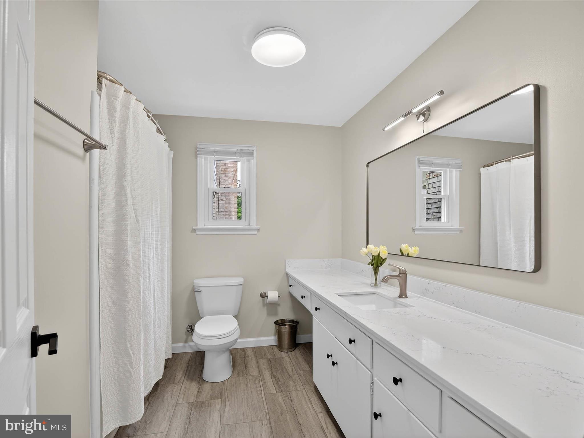 2010 Landis Valley Road Lancaster, PA 17601 - Photo 35 of 76 a spacious bathroom with a toilet a sink and a mirror
