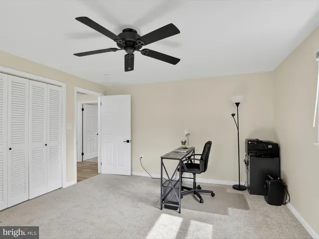an aerial view of a house with yard and outdoor seating