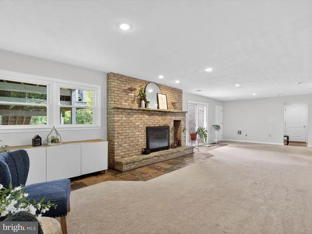 a view of green field with trees in the background