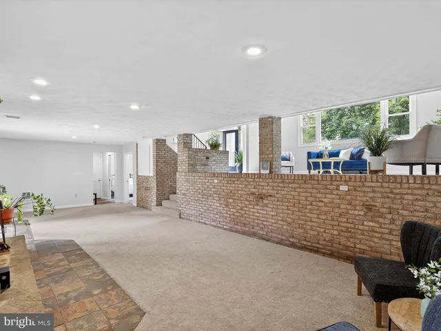 a view of green field with trees in the background