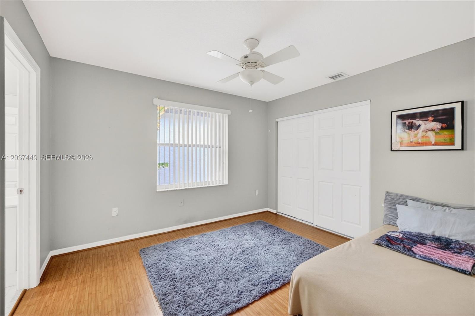 17488 Southwest 28th Court Miramar, FL 33029 - Photo 29 of 50 a bedroom with a bed and a window