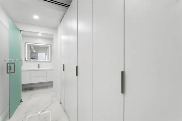 a bathroom with a sink and mirror