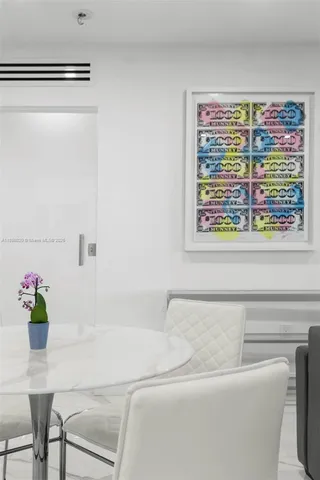 a living room with a couch and a potted plant