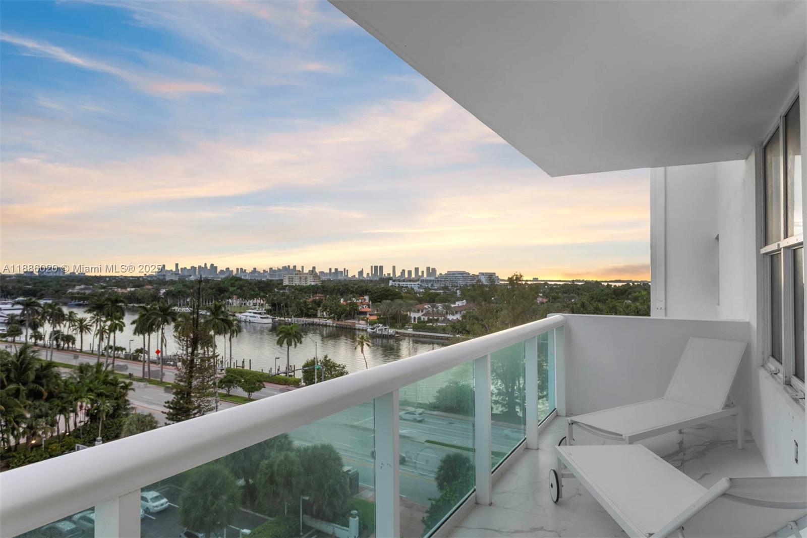 5001 Collins Avenue, Unit 8C Miami Beach, FL 33140 - Photo 4 of 27 a view of a lake from a balcony