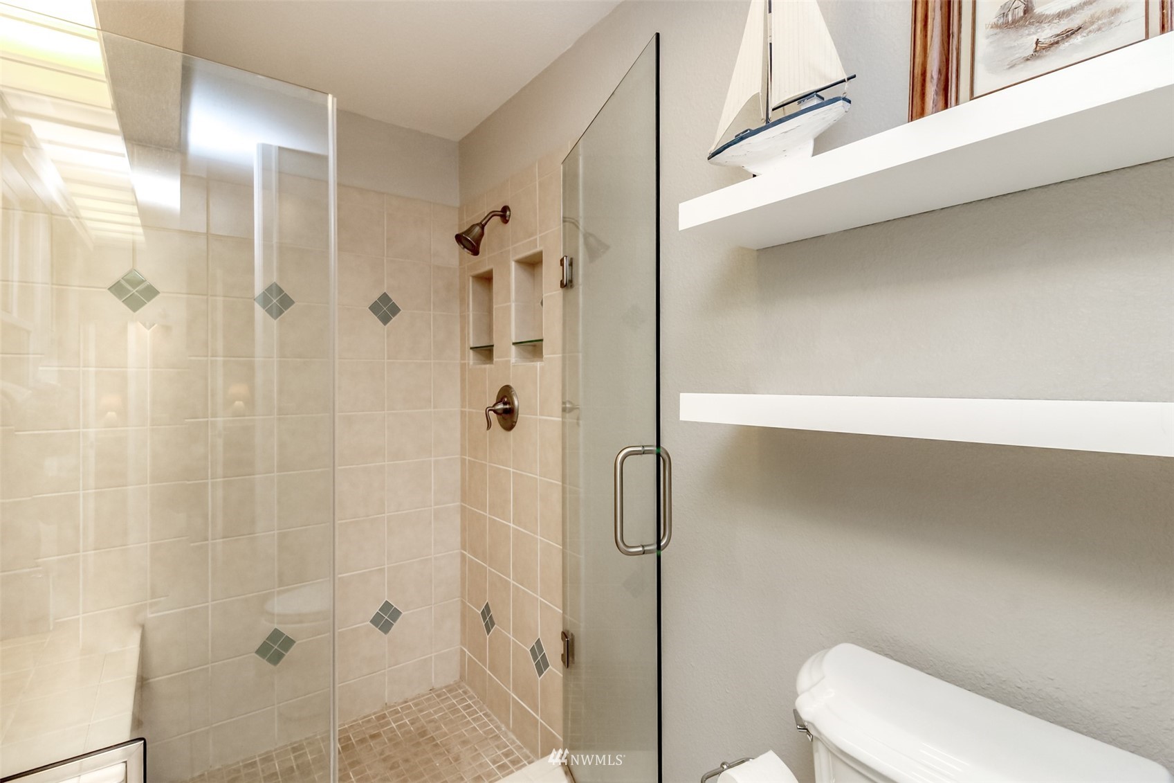 6102 Agnes Road Northeast Tacoma, WA 98422 - Photo 23 of 40 a bathroom with a toilet and shower