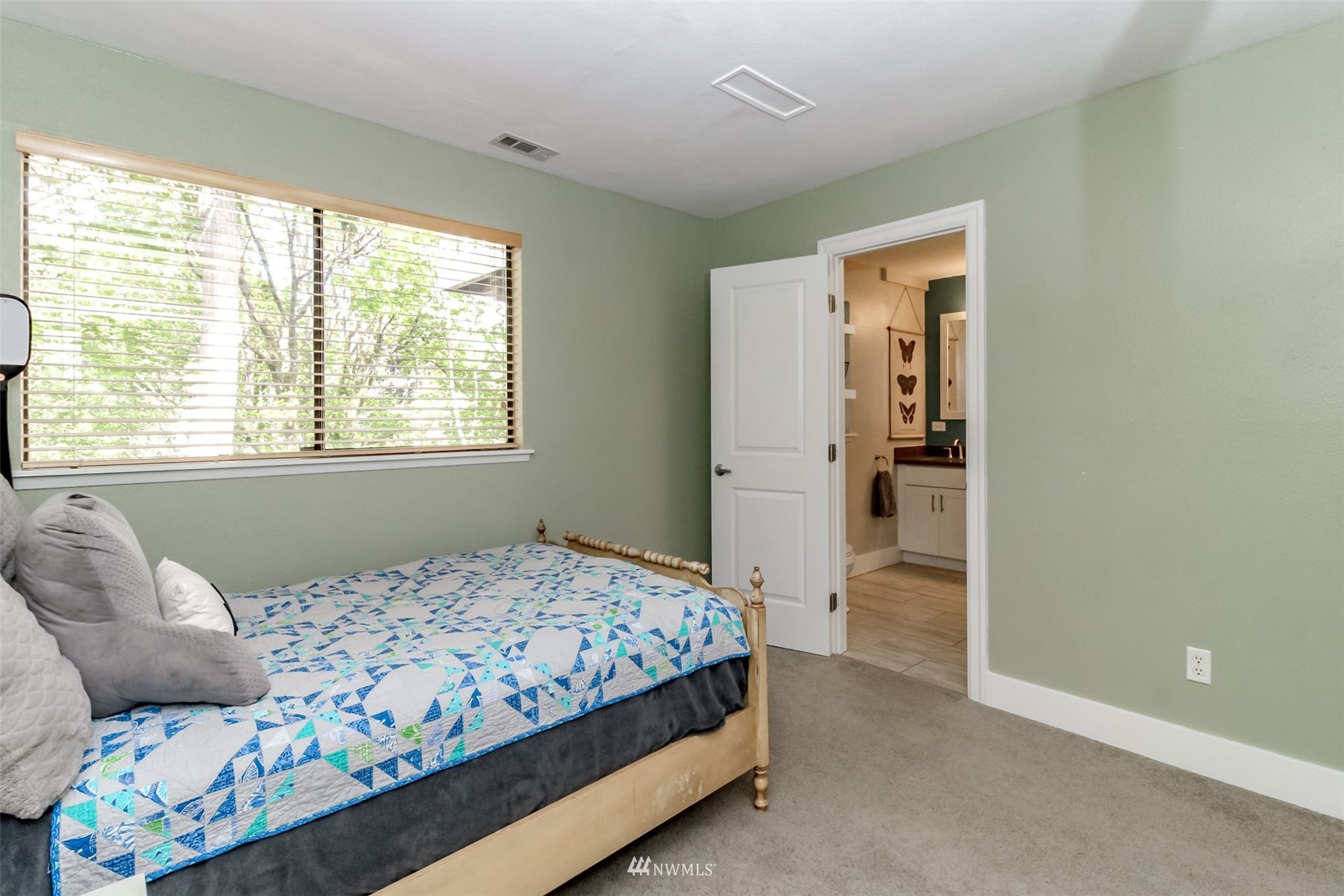 6102 Agnes Road Northeast Tacoma, WA 98422 - Photo 30 of 40 a bedroom with a bed and a window