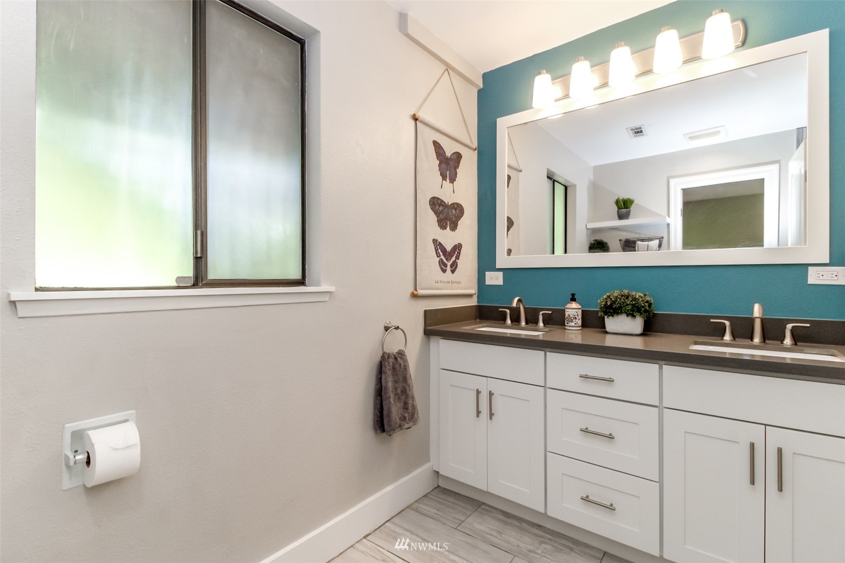 6102 Agnes Road Northeast Tacoma, WA 98422 - Photo 32 of 40 a bathroom with a sink vanity and mirror