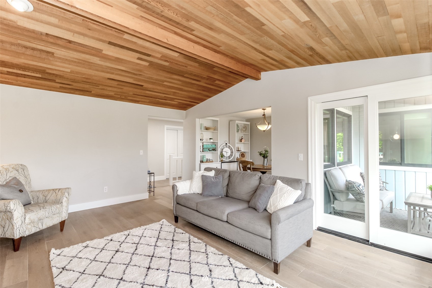 6102 Agnes Road Northeast Tacoma, WA 98422 - Photo 7 of 40 a living room with furniture and a chandelier