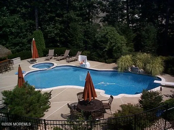 a view of a swimming pool with a patio