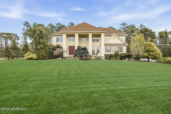a front view of a house with a yard