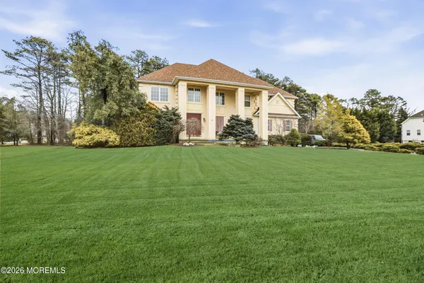 a front view of a house with a yard
