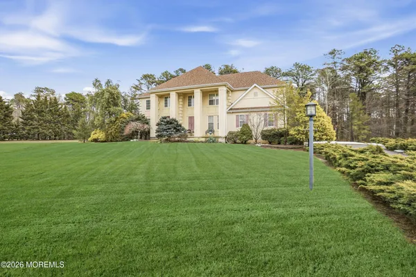front view of a house with a garden
