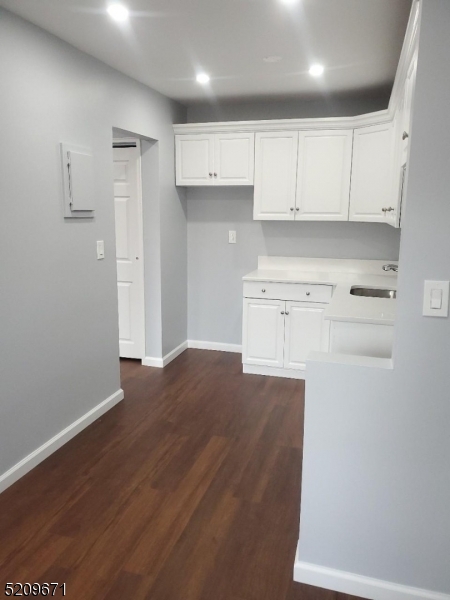 195 Main Street, Unit 3B Millburn, NJ 07041 - Photo 4 of 7 a view of kitchen with wooden floor