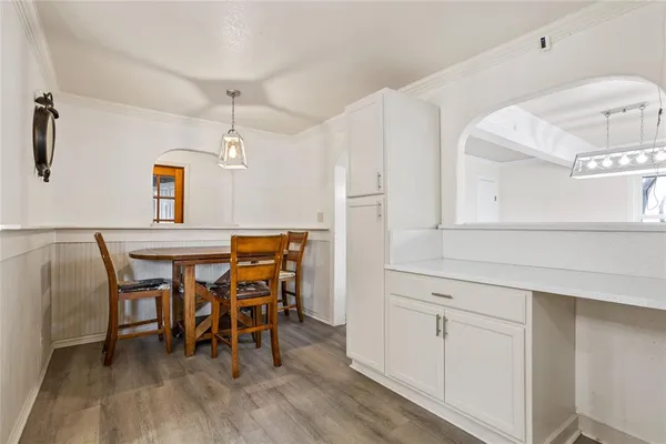 a dining room with furniture and window