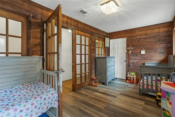 a bedroom with furniture and a window