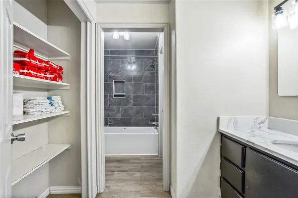 a bathroom with a shower and a sink