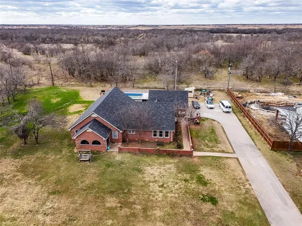 an aerial view of residential houses with outdoor space
