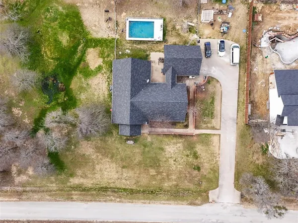 a aerial view of a house with a yard
