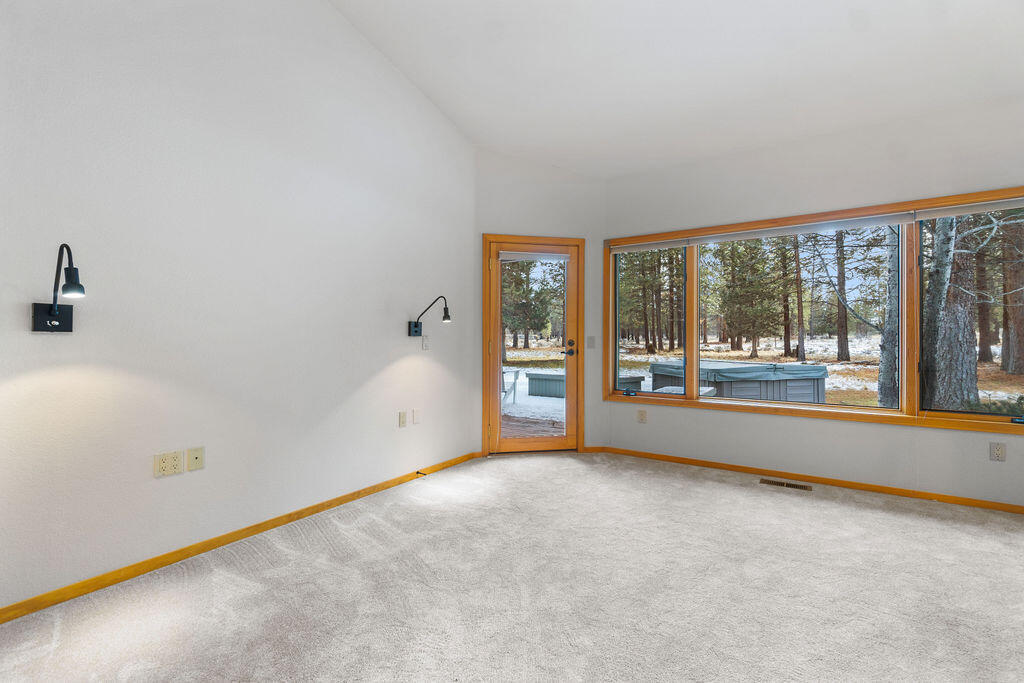 60013 West Ridgeview Drive Bend, OR 97702 - Photo 22 of 43 Vaulted ceilings and convenient access to the hot tub for ultimate relaxation under the Central Oregon skies.