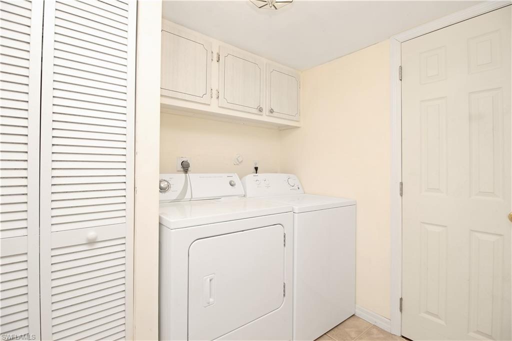 3471 County Barn Road, Unit F103 Naples, FL 34112 - Photo 17 of 27 a utility room with dryer and washer