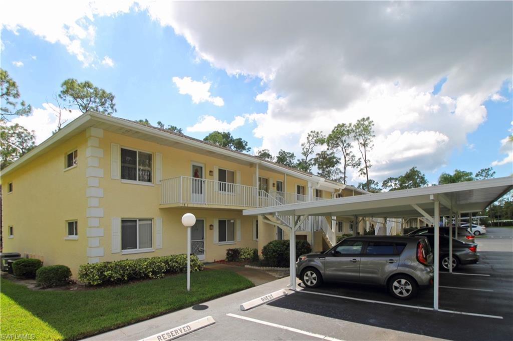 3471 County Barn Road, Unit F103 Naples, FL 34112 - Photo 22 of 27 a view of a car park in front of house