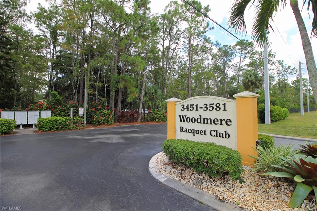 3471 County Barn Road, Unit F103 Naples, FL 34112 - Photo 23 of 27 a sign on the side of the road