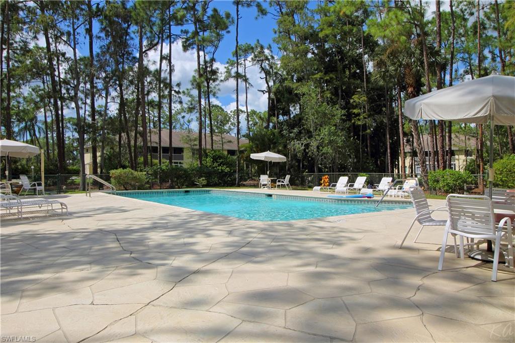 3471 County Barn Road, Unit F103 Naples, FL 34112 - Photo 25 of 27 a view of a park with plants and trees