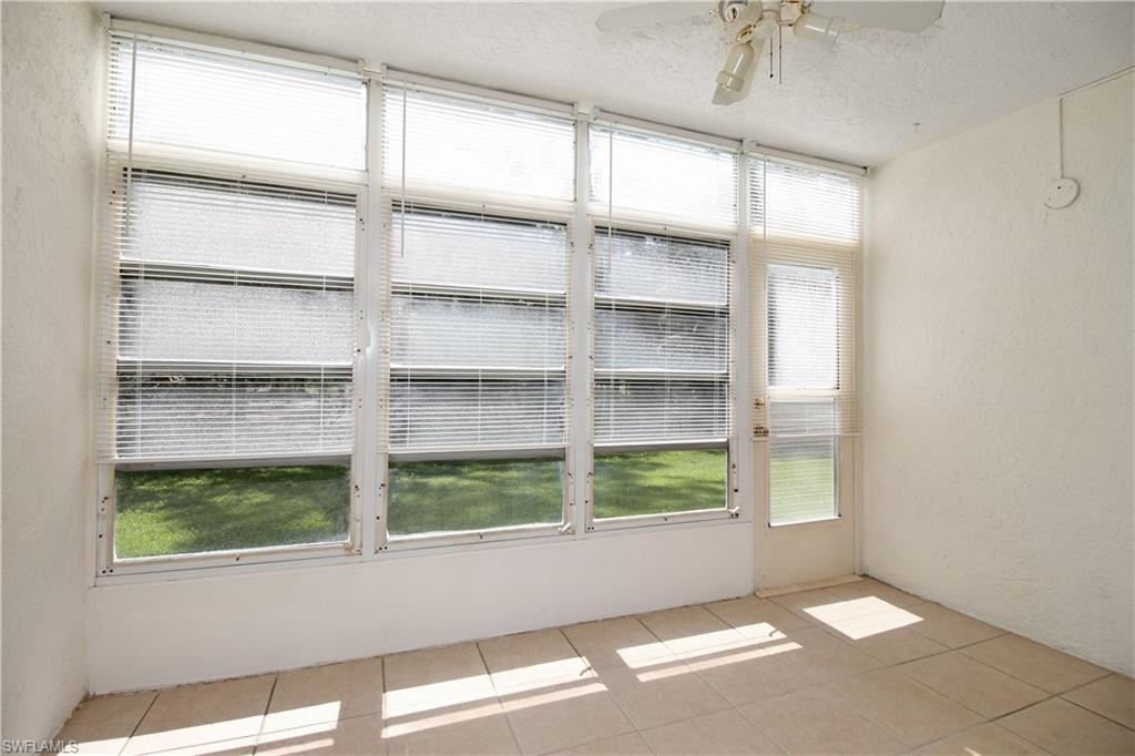 3471 County Barn Road, Unit F103 Naples, FL 34112 - Photo 3 of 27 a view of an empty room with a window