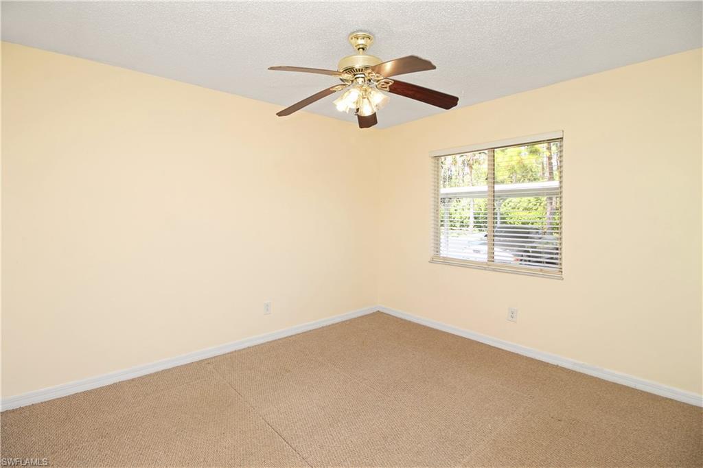 3471 County Barn Road, Unit F103 Naples, FL 34112 - Photo 9 of 27 a view of an empty room with a window