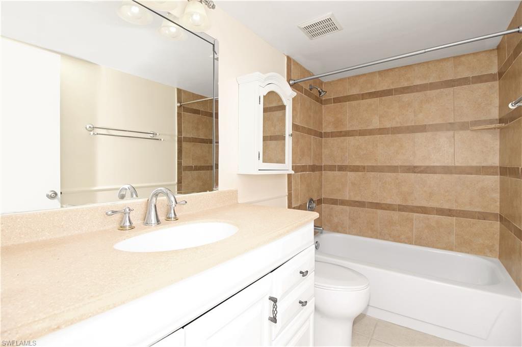 3471 County Barn Road, Unit F103 Naples, FL 34112 - Photo 10 of 27 a bathroom with a sink and a bathtub