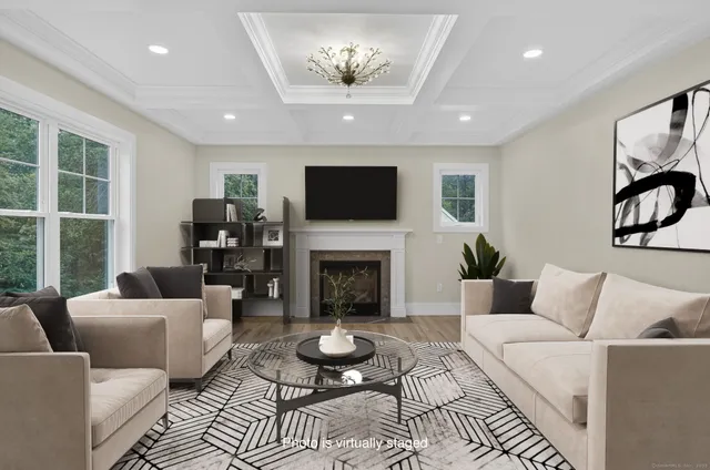a view of a dining room with furniture and chandelier