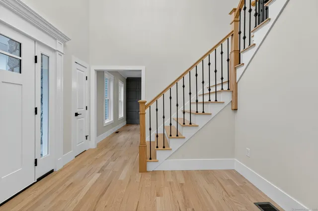 a living room with furniture and a clock