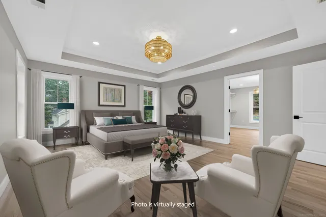 a view of an empty room and painting on the wall