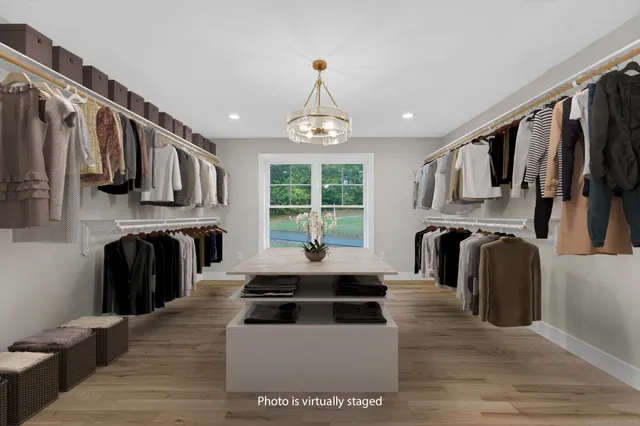 a bathroom with a double vanity sink toilet and shower