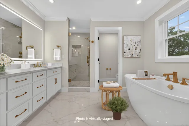 a white bath tub sitting in a bathroom