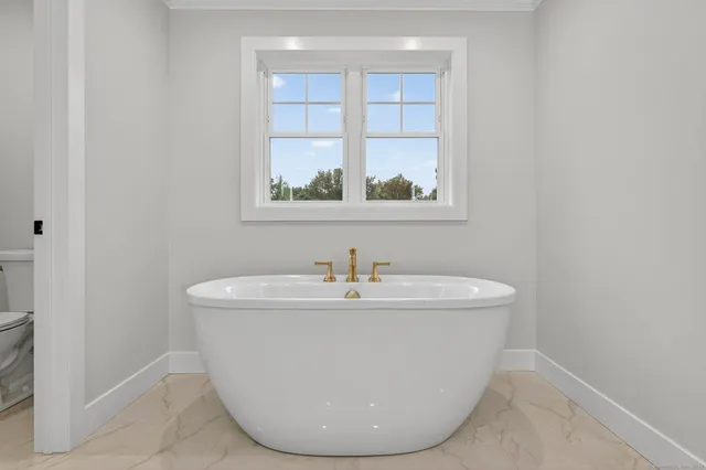 a bathroom with double vanity sink a mirror and