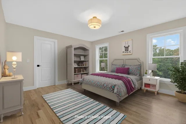 a view of an empty room and wooden floor