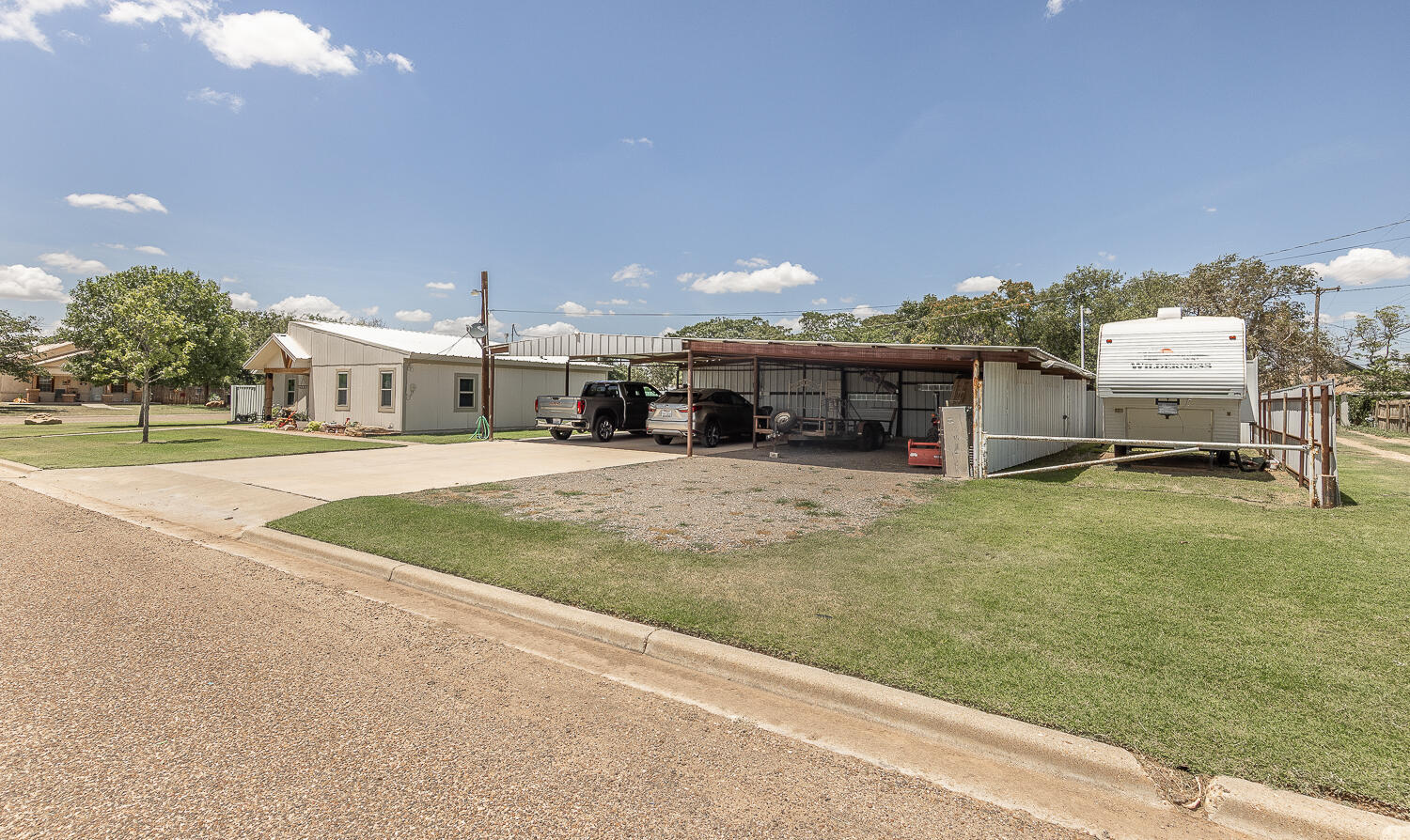 450 South 12th Street Slaton, TX 79364 - Photo 25 of 26 a swimming pool with outdoor seating and yard