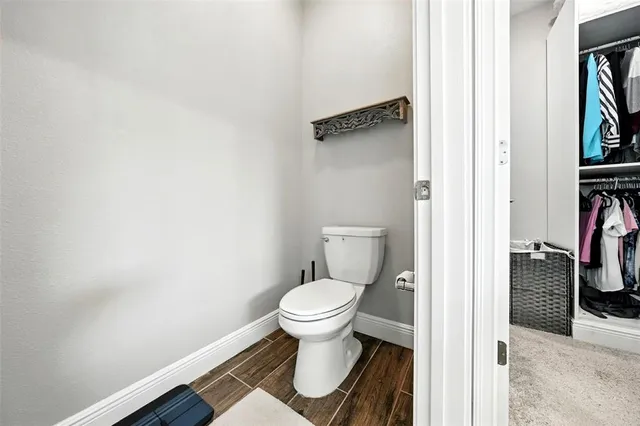 a bedroom with a bed and a desk