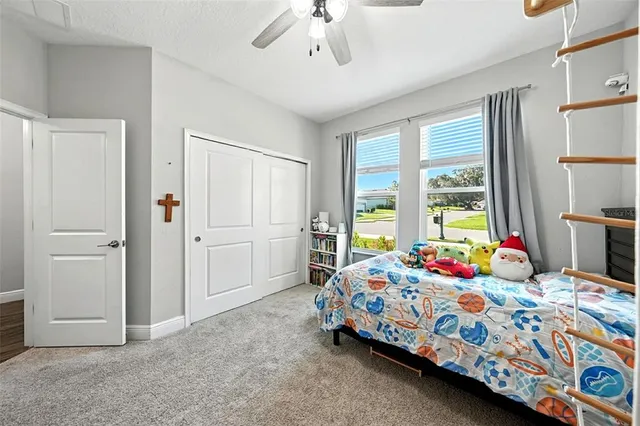 a view of a hallway with workspace and a window