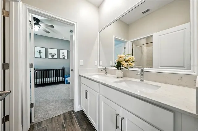 an aerial view of a swimming pool with outdoor seating and yard